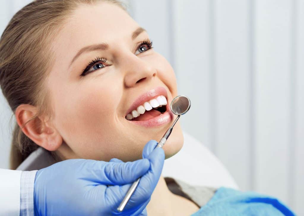 Woman Smiling After Dental Implants